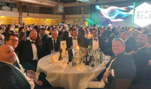 MGAC staff and guests smile around a table at the Property Week RESI Awards